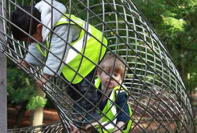 daycare nursery activities children climbing on climbing framing