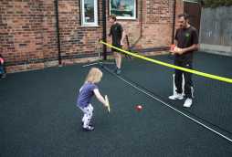 garden and play areas at poplars day nurseries, toddlers playing tennis