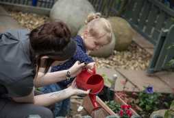 garden facilities at poplars day nurseries, child watering can