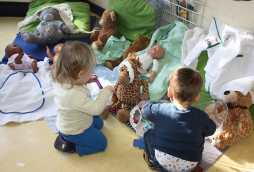 facilities at poplars day nurseries, children playing with toys on floor